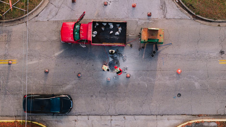 Top-down view of workers doing road maintenance in Chattanooga, TN.
